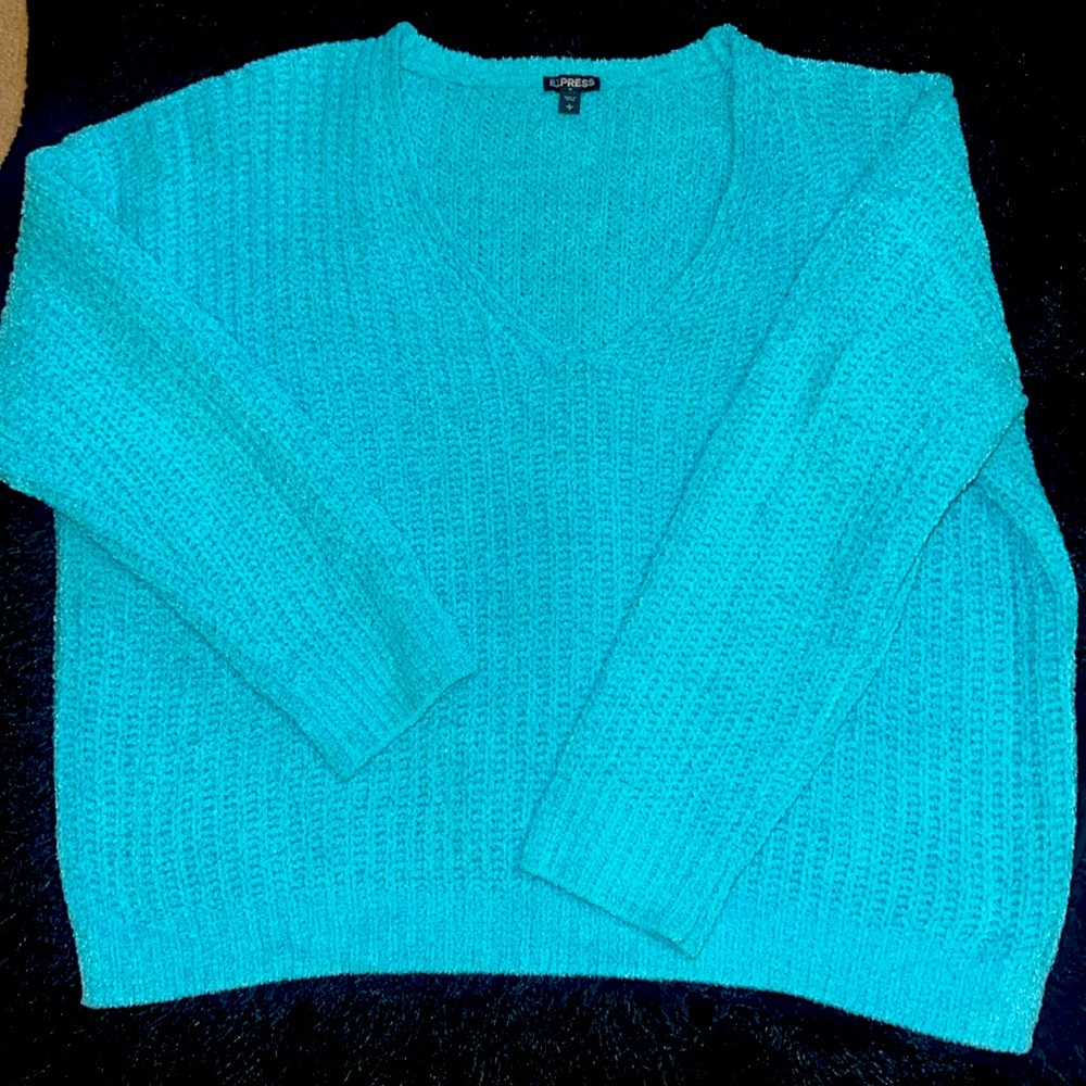 Turquoise blue sweater worn a few times.